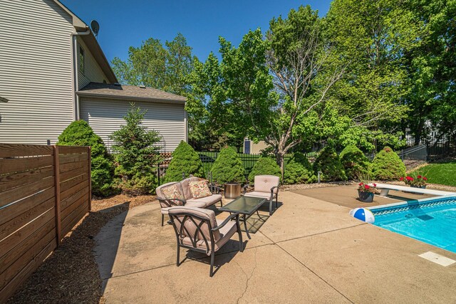 view of patio featuring outdoor lounge area and a fenced backyard
