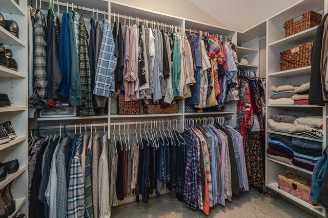 walk in closet featuring vaulted ceiling