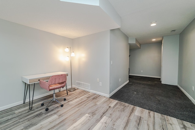 office space with wood finished floors, baseboards, and recessed lighting