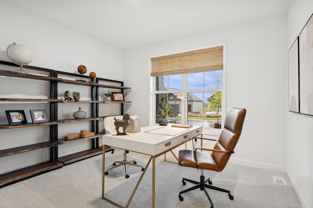 home office with visible vents, carpet flooring, and baseboards