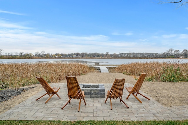 view of patio with a water view