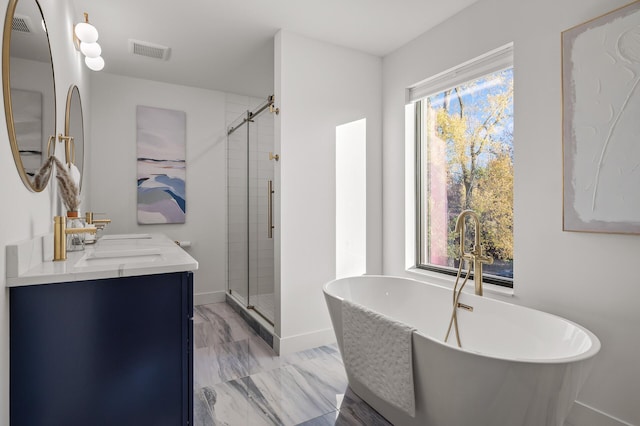 full bathroom featuring double vanity, a stall shower, a soaking tub, visible vents, and a sink