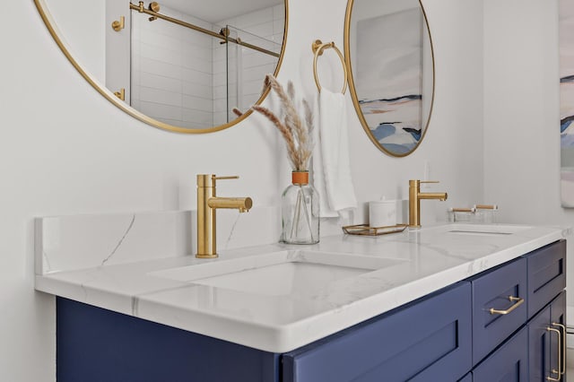 full bathroom with double vanity and a sink