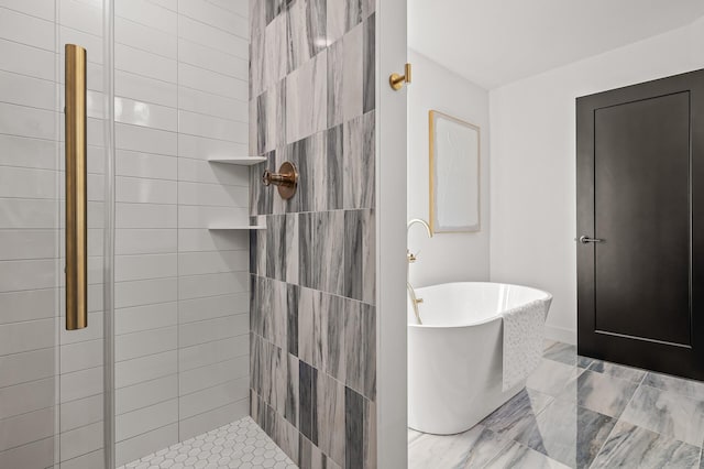 bathroom featuring tiled shower and a soaking tub