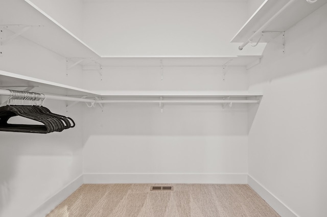 walk in closet with carpet and visible vents