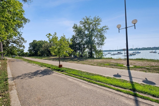 2950 Dean Pkwy Unit 2005, Minneapolis, MN 55416 - view of asphalt road with a water view and sidewalks