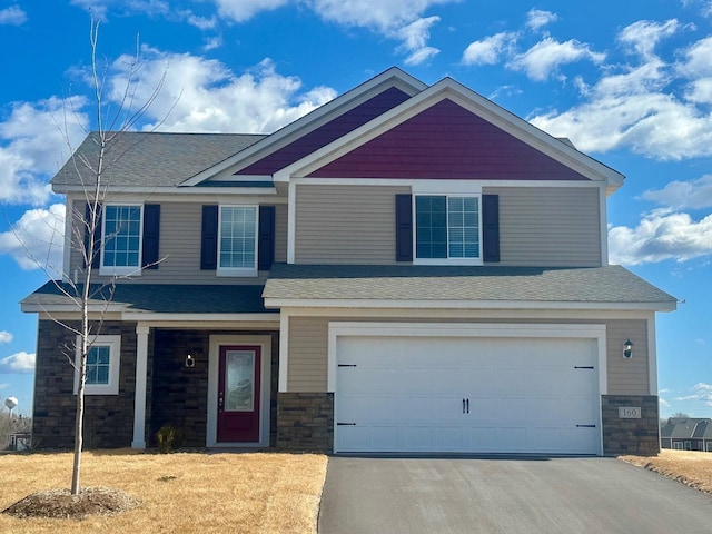 160 Summerfield Dr, Waverly, MN 55390 - craftsman-style home with an attached garage, roof with shingles, aphalt driveway, and stone siding