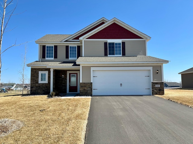 160 Summerfield Dr, Waverly, MN 55390 - craftsman house featuring an attached garage, driveway, a front yard, and stone siding