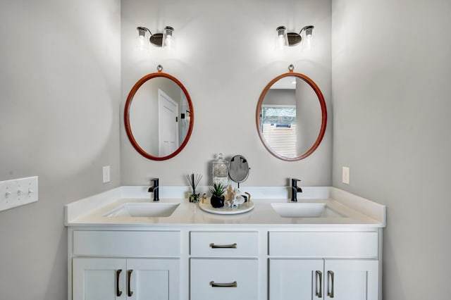 full bath with double vanity and a sink