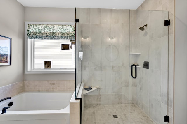full bath featuring a garden tub and a stall shower