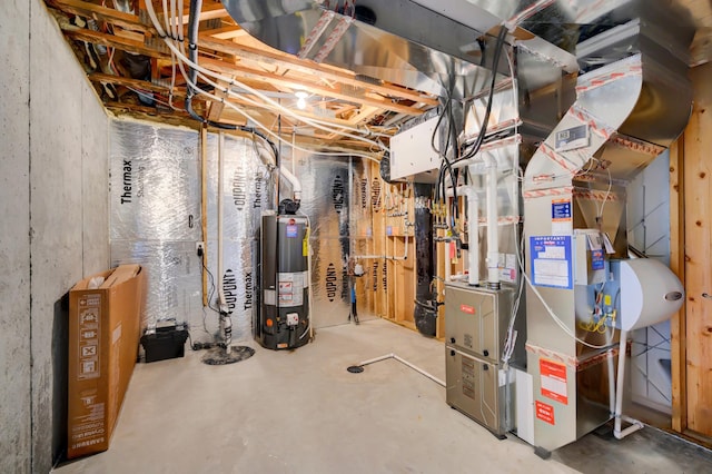 utility room featuring water heater