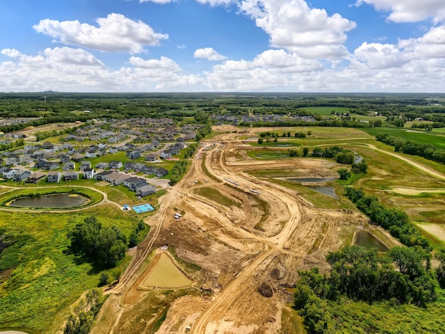 birds eye view of property featuring a residential view and a water view