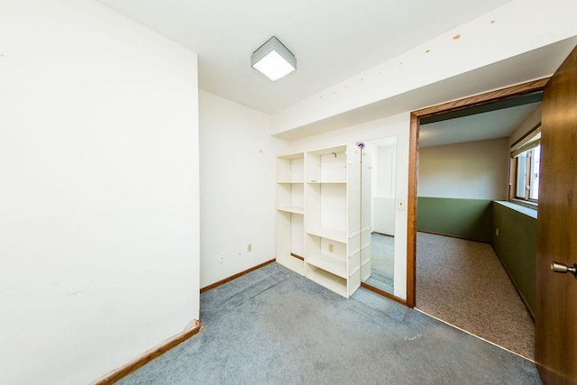interior space featuring carpet and baseboards