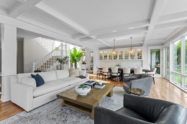 2625 Woodbridge Rd, Minnetonka Beach, MN 55391 - living area featuring coffered ceiling, healthy amount of natural light, wood finished floors, stairs, and beam ceiling