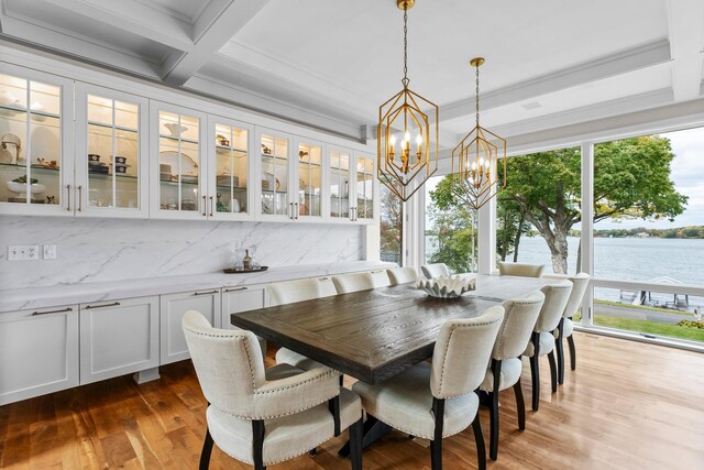 2625 Woodbridge Rd, Minnetonka Beach, MN 55391 - dining space with beamed ceiling, a chandelier, wood finished floors, and a water view