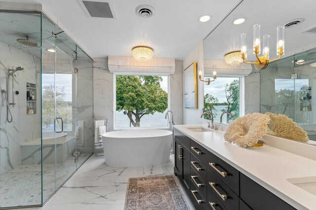 2625 Woodbridge Rd, Minnetonka Beach, MN 55391 - bathroom with a marble finish shower, double vanity, a freestanding tub, marble tiled flooring, and a chandelier