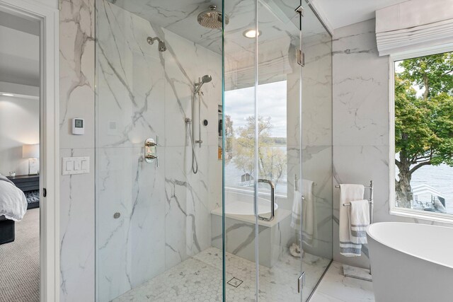 2625 Woodbridge Rd, Minnetonka Beach, MN 55391 - ensuite bathroom with a marble finish shower, marble tiled floors, and a freestanding bath