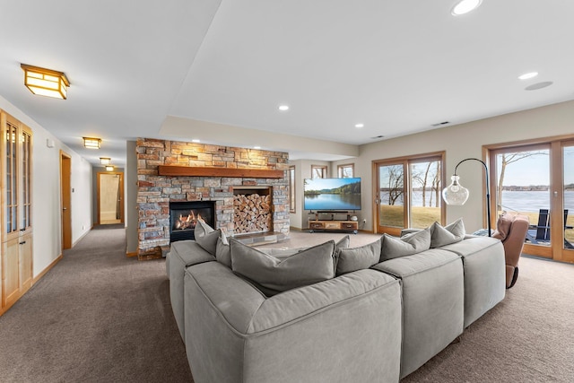 2625 Woodbridge Rd, Minnetonka Beach, MN 55391 - carpeted living area with a stone fireplace and recessed lighting