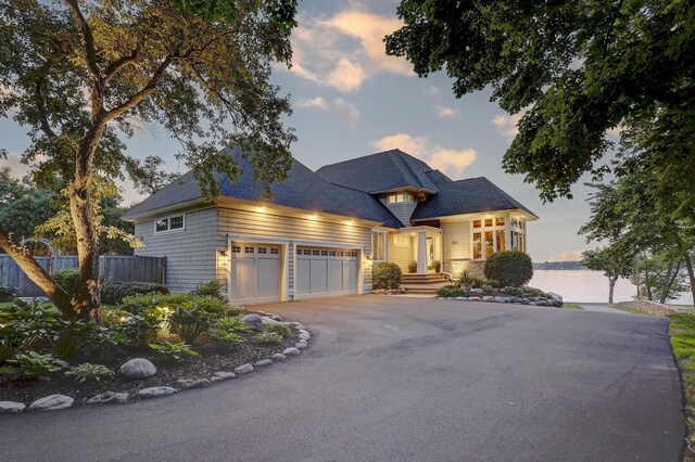 2625 Woodbridge Rd, Minnetonka Beach, MN 55391 - view of front of house featuring an attached garage and asphalt driveway