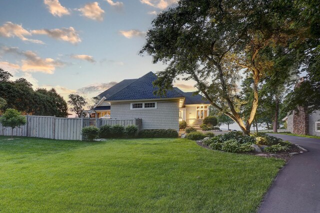 2625 Woodbridge Rd, Minnetonka Beach, MN 55391 - property exterior at dusk featuring roof with shingles
