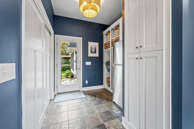 2625 Woodbridge Rd, Minnetonka Beach, MN 55391 - entrance foyer featuring baseboards and stone finish floors
