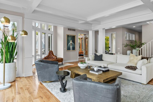 2625 Woodbridge Rd, Minnetonka Beach, MN 55391 - living room with coffered ceiling, light wood-style flooring, beamed ceiling, and stairs