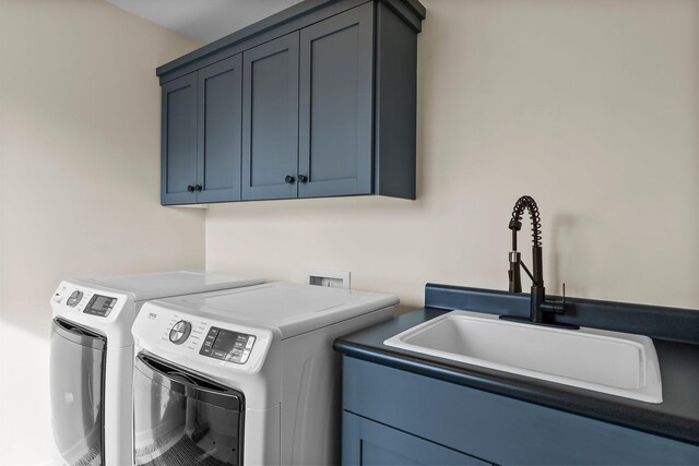 2625 Woodbridge Rd, Minnetonka Beach, MN 55391 - laundry area featuring cabinet space and independent washer and dryer