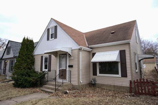 view of front of house featuring roof with shingles