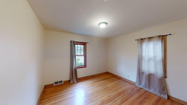 2849 Jersey Ave S, Saint Louis Park, MN 55426 - spare room featuring light wood finished floors and baseboards