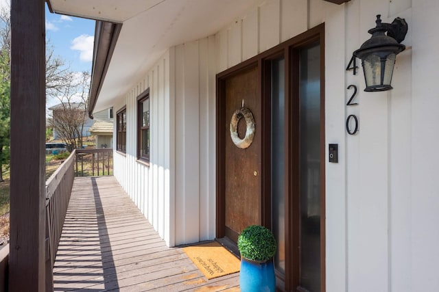 view of exterior entry with board and batten siding