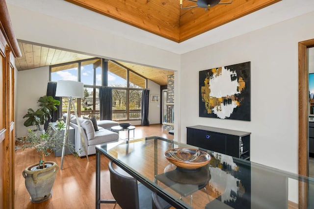 dining area featuring wooden ceiling, wood finished floors, and lofted ceiling