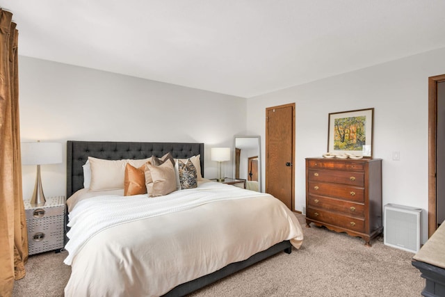 bedroom with light carpet and visible vents
