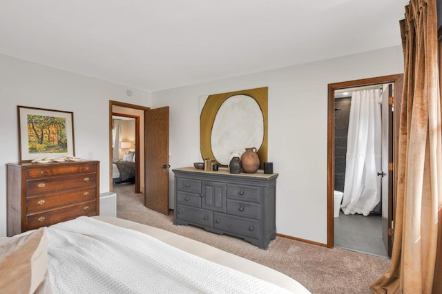 bedroom with baseboards and carpet flooring