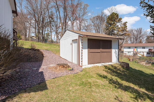 view of shed featuring fence
