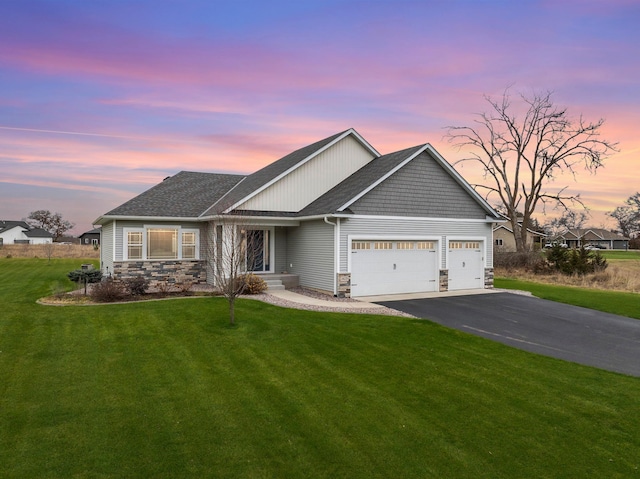 24235 143rd St NW, Zimmerman, MN 55398 - craftsman inspired home with stone siding, a garage, asphalt driveway, and a front yard