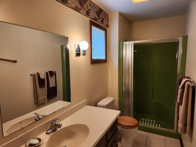 bathroom featuring a shower stall, tile patterned flooring, vanity, and toilet