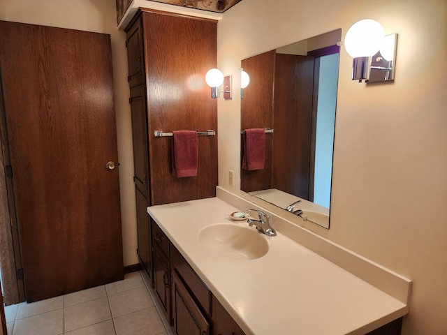 bathroom featuring tile patterned flooring and vanity