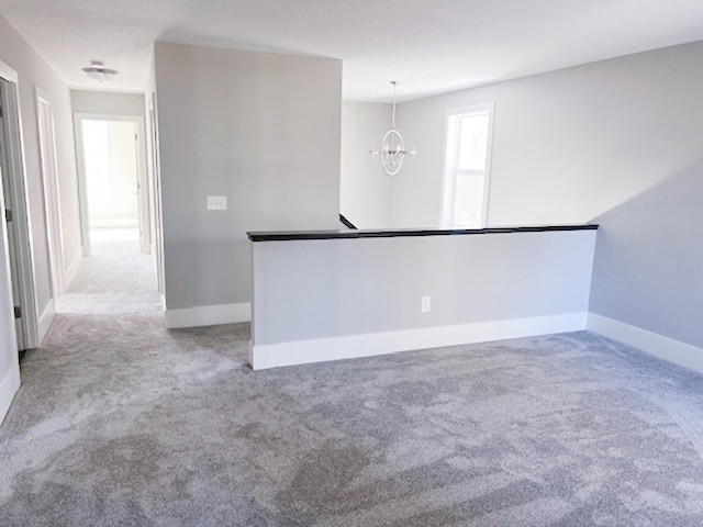 13357 Two Mile Rd, Brainerd, MN 56401 - carpeted empty room featuring a chandelier and baseboards