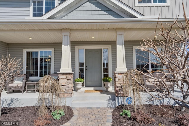 doorway to property featuring a porch