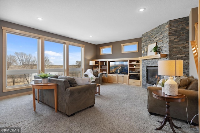 living room with recessed lighting, a fireplace, and carpet flooring