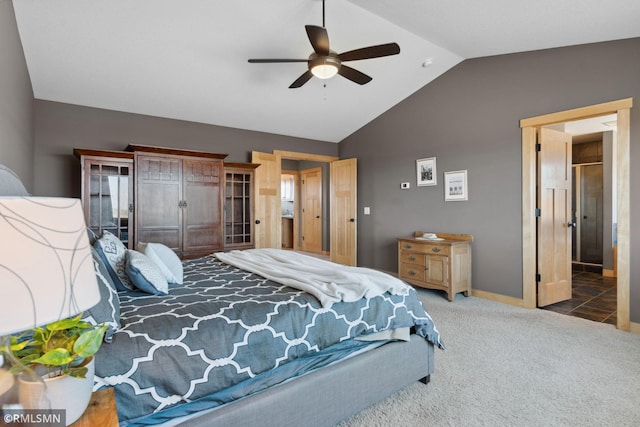carpeted bedroom with baseboards, a ceiling fan, and vaulted ceiling