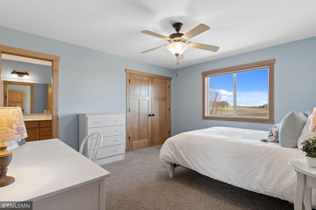 carpeted bedroom featuring a ceiling fan