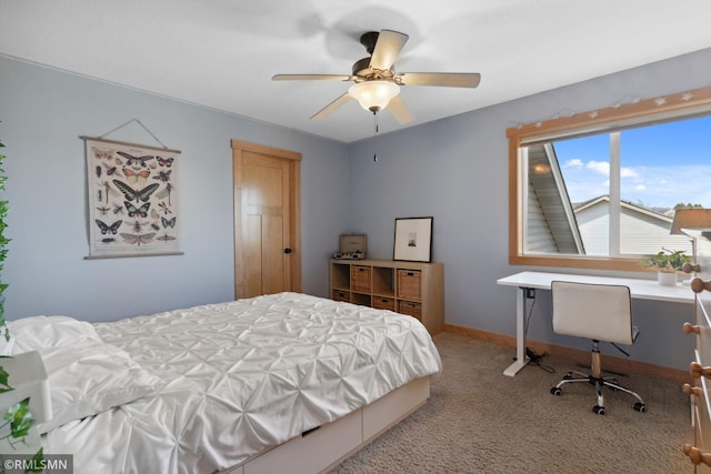 carpeted bedroom with baseboards and ceiling fan