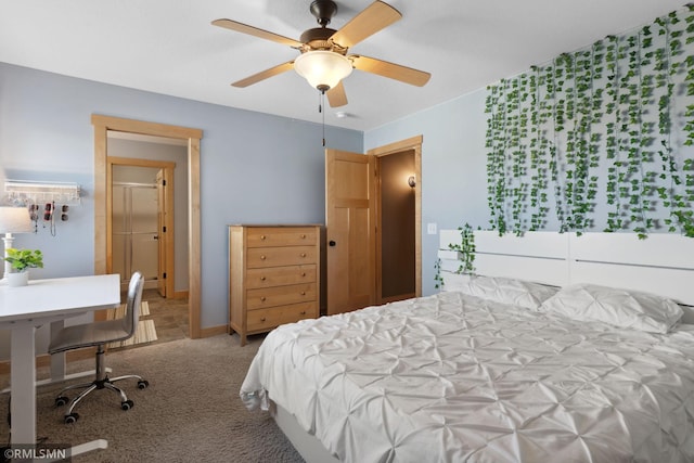carpeted bedroom featuring baseboards and ceiling fan