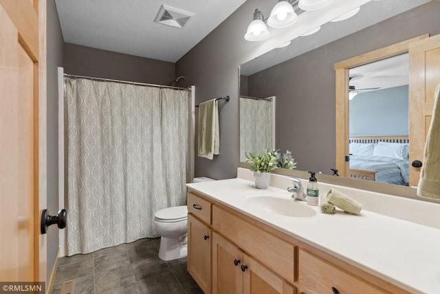 full bathroom with visible vents, ceiling fan, toilet, connected bathroom, and vanity