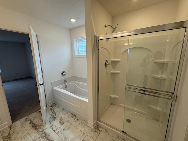 bathroom with marble finish flooring, a stall shower, a bath, baseboards, and recessed lighting