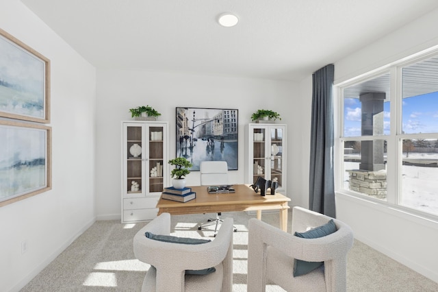 office featuring healthy amount of natural light, carpet, and baseboards