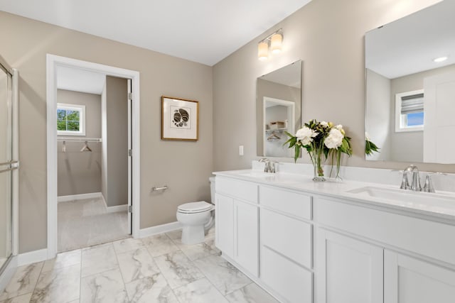 full bathroom with a stall shower, marble look tiles, toilet, double vanity, and baseboards