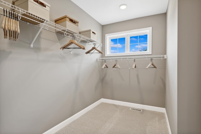 walk in closet with carpet and visible vents