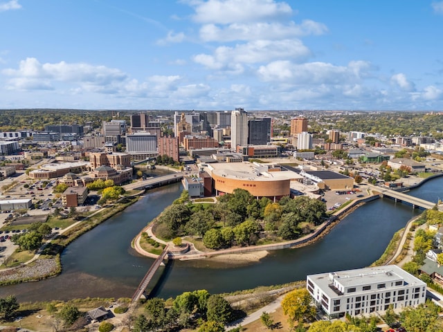 birds eye view of property featuring a water view and a view of city
